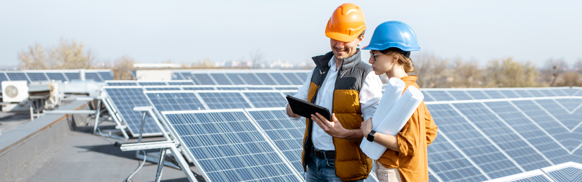 Two engineers or architects examining the construction of a solar power plant